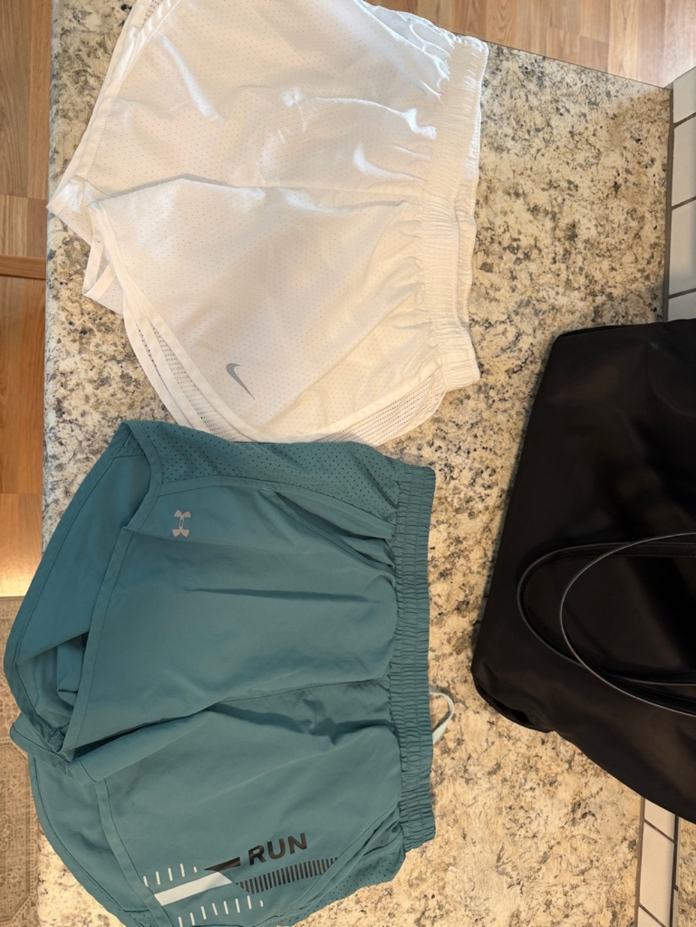 Nike White Athletic Shorts and teal UA shorts (selling as set)